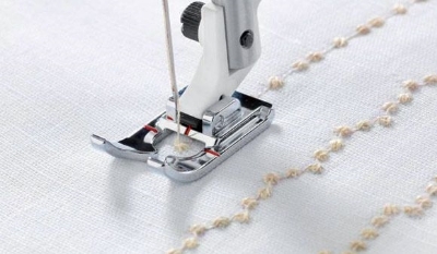 Mynd af Candlewicking fótur Husqvarna