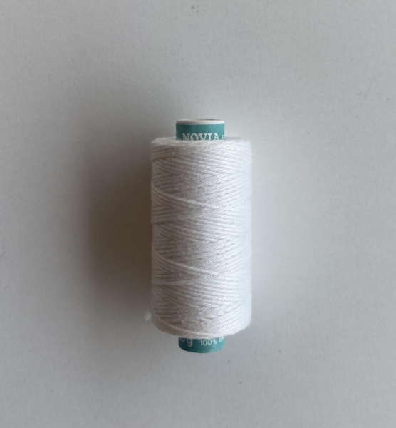 Mynd af Undirleggsþráður fyrir hnappagöt í teygjanleg efni.